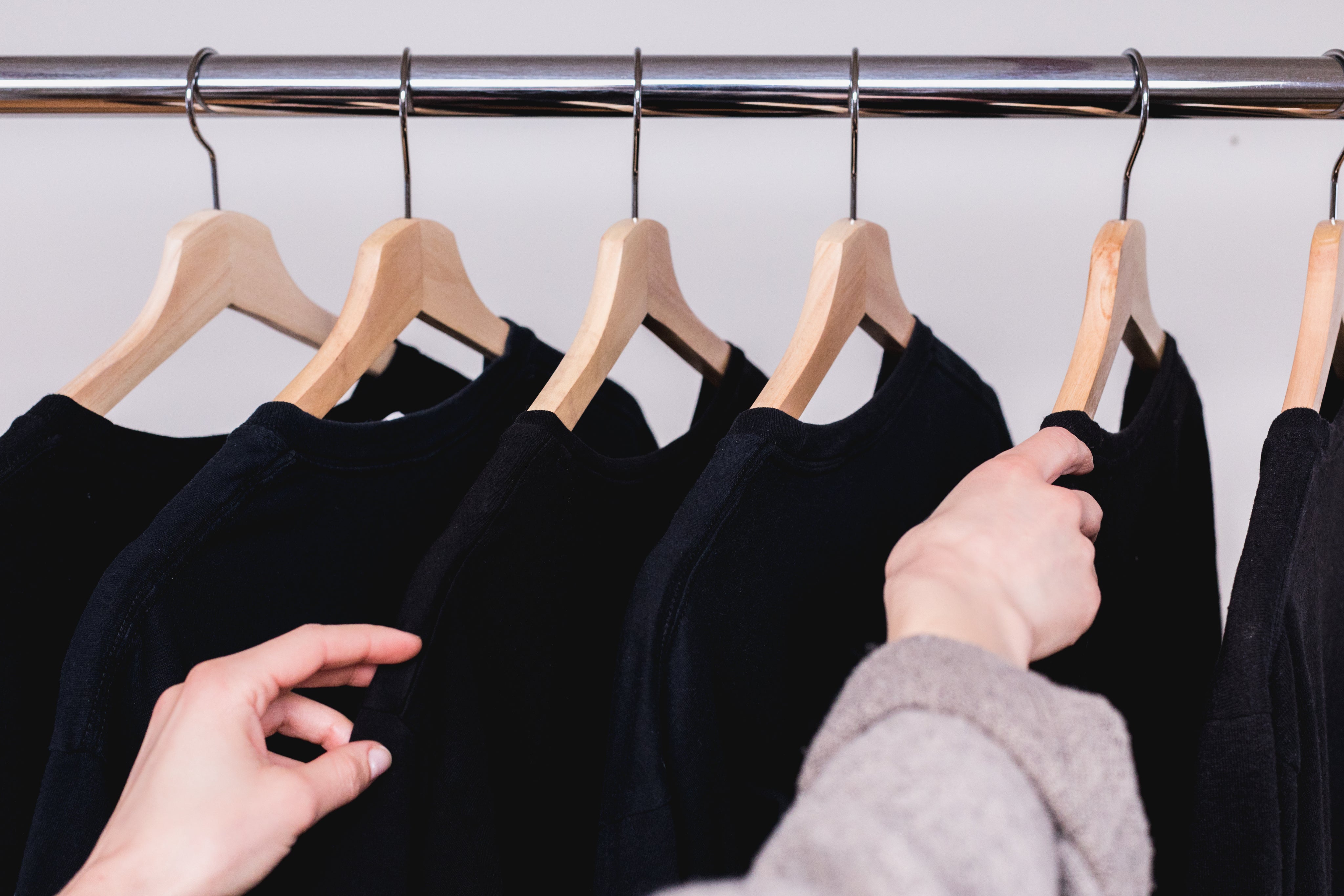 picking-a-dark-shirt-from-a-clothes-rack.jpg